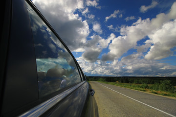 road in the field cloudy landscape