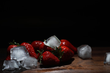 Fresh ripe strawberries on a wooden table