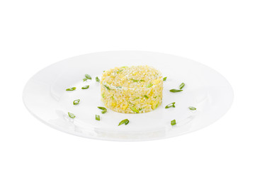 Long grain rice with green onion cooked portion of side dish on a plate on a white isolated background Side view. Appetizing dish for the menu restaurant, bar, cafe