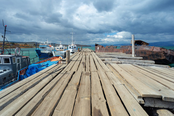 Naklejka premium pier at the fish factory on Baikal in cloudy weather