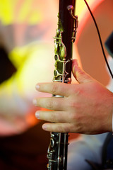 Fototapeta premium Musical instrument flute in the hands of a male musician.