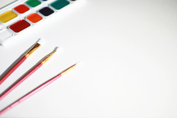 Drawing paints on a white sheet of paper