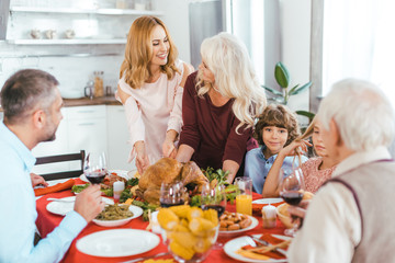 big happy family having thanksgiving dinner together at home