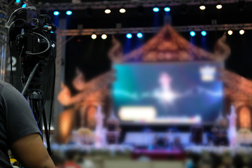 video production camera recording live event on stage. television social media broadcasting seminar...
