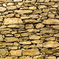 Rough old wall background, part of stone masonry