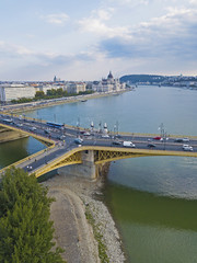 Fototapeta na wymiar Aerial view of Margaret Bridge over the Danube river with the Parliament building and the downtown of Budapest, Hungary