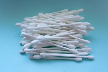 A lot of cotton buds on a blue background