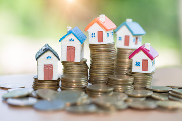 Mini house on stack of coins, Real estate investment, Save money with stack coin, Business growth investment and financial, Mortgage concept.