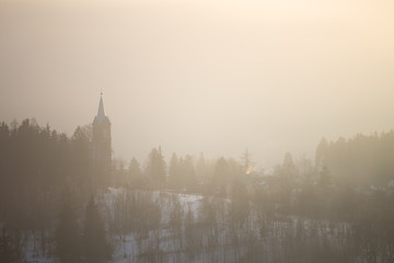 Fototapeta na wymiar Foggy winter landscape, Szklarska Poreba, Poland.