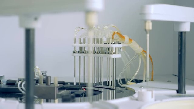 A centrifuge machine works in a laboratory of a clinic. 4K.