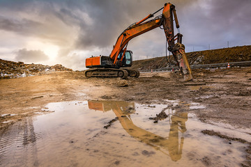 Works in the construction of a road extracting stone in a hard day of winter work