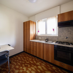 Vintage wood kitchen, tiles and bright window