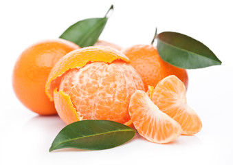 Fresh organic peeled mandarin fruit with leaves