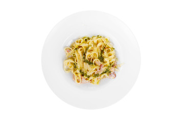Pasta, noodles with bacon and sauce pesto, decorated with cheese. view from above. Serving a meal in a cafe, restaurant. Isolated white