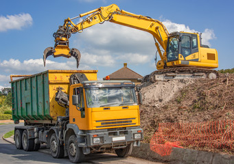 360 excavator with grab unit fitted loading disposal lorry
