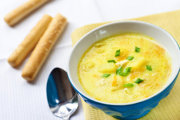 Cheese soup with chicken, potatoes and turmeric