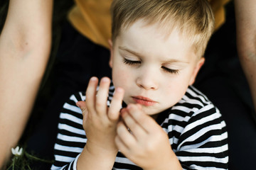 portrait of a young boy outdoors