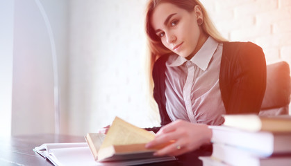 Young pretty blonde girl student