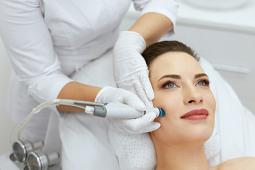 Face Skin Care. Closeup Of Woman Face Cleansing At Cosmetology