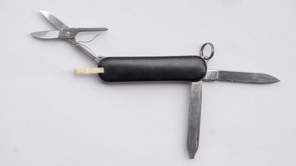 Black multipurpose knife on white background