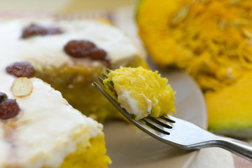 Pumpkin homemade cheesecake with white cream. Autumn still life. Thanksgiving day food.