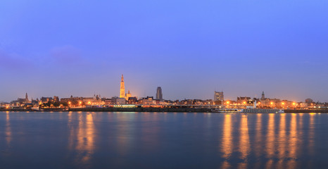 Plakat Beautiful cityscape panorama of the skyline of Antwerp, Belgium, during the blue hour seen from the shore of the river Scheldt