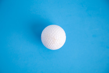 golf ball on blue color background