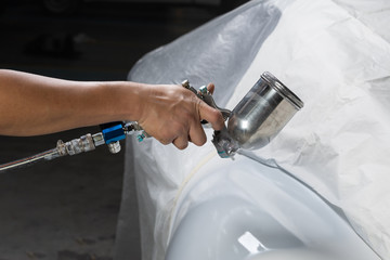 Auto body repair series: Sports car being repainted