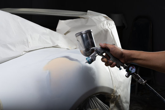 Fototapeta Auto body repair series: Sports car being repainted