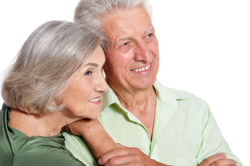 Portrait of happy senior couple on white background