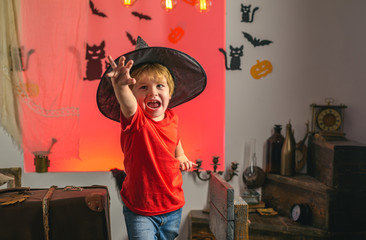 Child having fun at Halloween trick or treat. Children in america celebrate halloween. Expression...