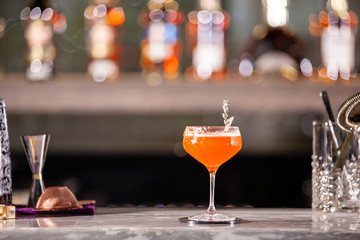 Bibliotheque cocktail on lounge bar counter. Relaxation drink