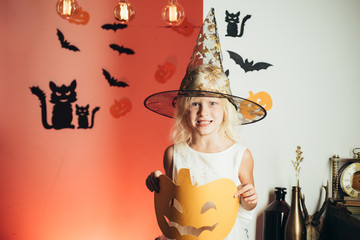 Childrens costumes for the celebration of Halloween. Happy laughing kid in costume to halloween....