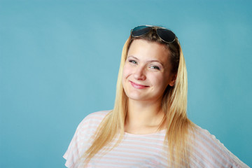Fototapeta premium Blonde woman wearing sunglasses and summer clothing