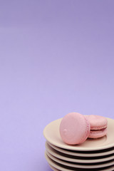 Two macaroons on saucers.