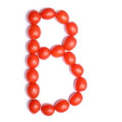 The letter B is made of tomato. Symbol of the English alphabet of tomato on a white background.