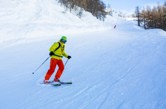 Image of sports man skiing on snowy slope