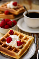 Belgian waffles with raspberry for breakfast