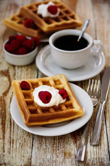 Belgian waffles with raspberry for breakfast