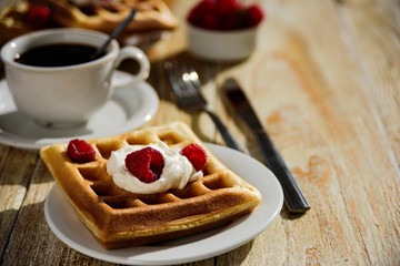 Belgian waffles with raspberry for breakfast