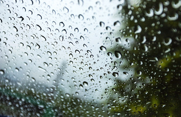 Water drops on glass in beautiful natural rain Use for background and wallpapers.