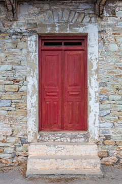 Red door of stony house