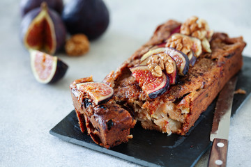 Homemade delicious fig cake with nuts on board