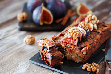 Homemade delicious fig cake with nuts on board