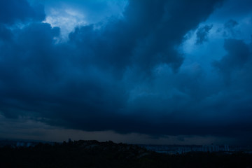 Fototapeta na wymiar Dramatic dangerous dark blue cloudscape