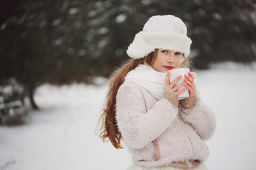 Obraz premium little happy beautiful girl in winter forest