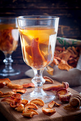 Compote of dried fruits with ingridients on rustic wooden background