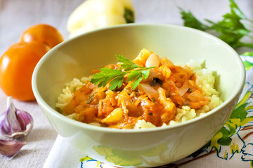 Steamed rice with stewed vegetables and turmeric