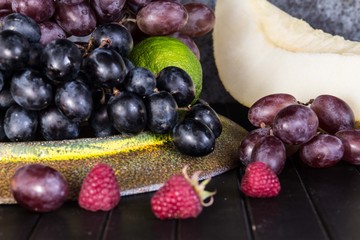 Raw Organic Fruit Platter with Berries Melons and Grapes