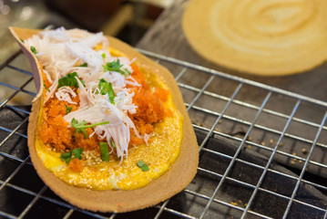 Khanom Beaung Thai or a kind of filled pancake Thai food or Thai Style Crisp Tart on tray, Thailand.